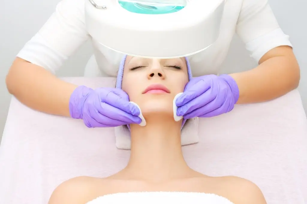 Client receiving a professional acne facial treatment