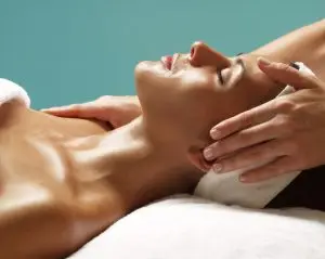 Woman with smooth, glowing skin experiencing brightening benefits of Vitamin C treatment